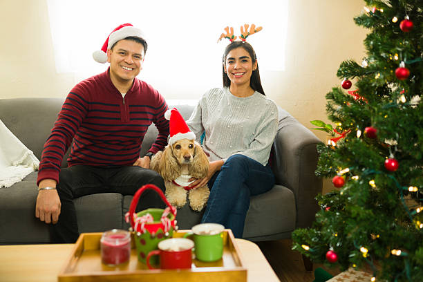 istock Cheerful couple celebrating christmas with their dog 2233433276