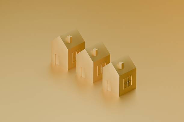 istock group of gold 3d houses on plain background 2233436248