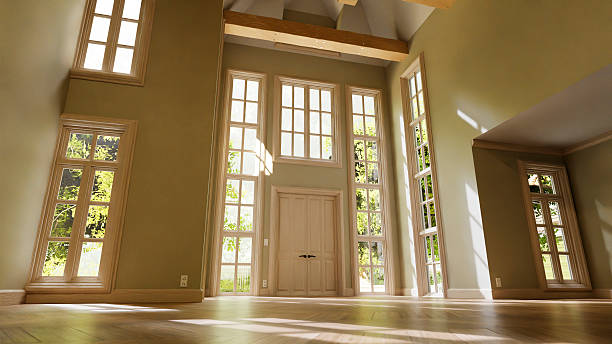 istock Sunlight illuminating empty room with parquet and tall windows 2233436384