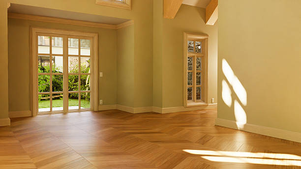 istock Sunlight illuminating empty room with parquet flooring 2233436403