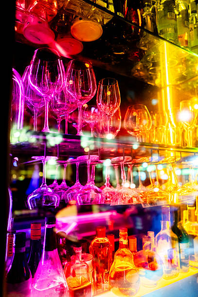 istock Drinking Glasses Illuminated by Colourful LED Lights 2233436816