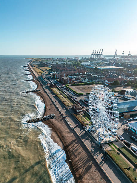 istock Ferris wheel stands on felixstowe seafront with docks in background 2233438730