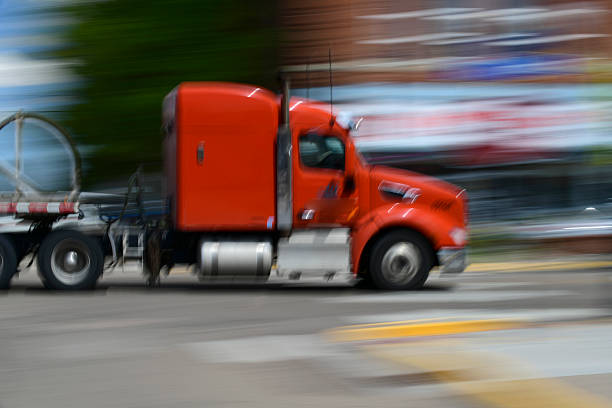 Walsenburg, Colorado USA- August 27, 2025  A Semi Truck rolls through town. A slow shutter was used to capture a sense of Motion. Copy space available.