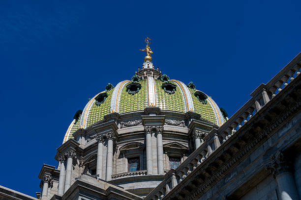 Detroit, USA - June 13, 2024: Decorative stone sculptures in pediment. The Wayne County Building is a historic landmark and tourist attraction.