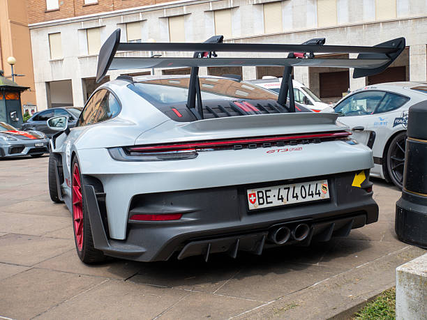 Cremona, Italy August 22nd 2025 Parked Porsche 911 GT3 RS, featuring a striking rear wing and red accents, exudes high performance engineering with its aggressive styling and track focused design