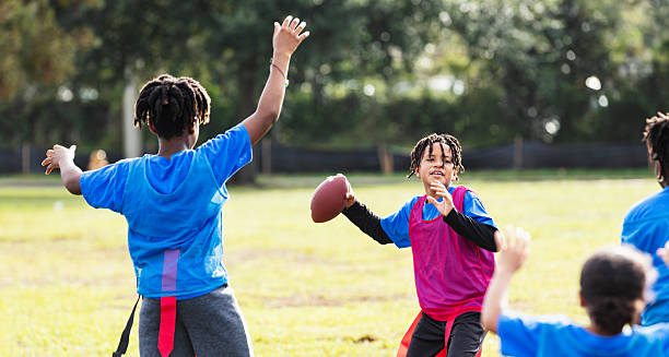 istock Hispanic boy playing flag football, throwing ball 2233441758