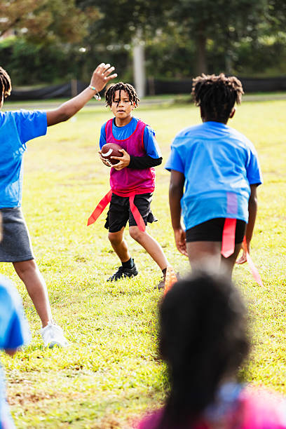 istock Hispanic boy playing flag football, throwing ball 2233441763