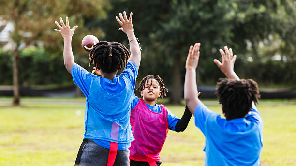istock Multiracial children playing flag football 2233441773