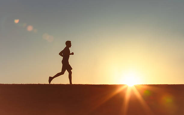 istock Men jogging early morning outdoors. 2233441938