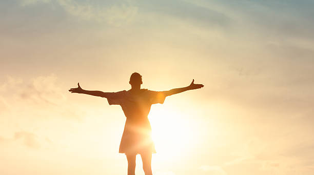 istock Woman feeling happy and free at sunset. 2233441947