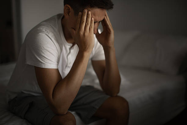 istock Stressed man with strong headache, migraine. 2233441979