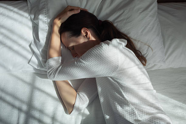 istock Woman in her bed feeling unhappy, alone, depressed, sleepless 2233442047