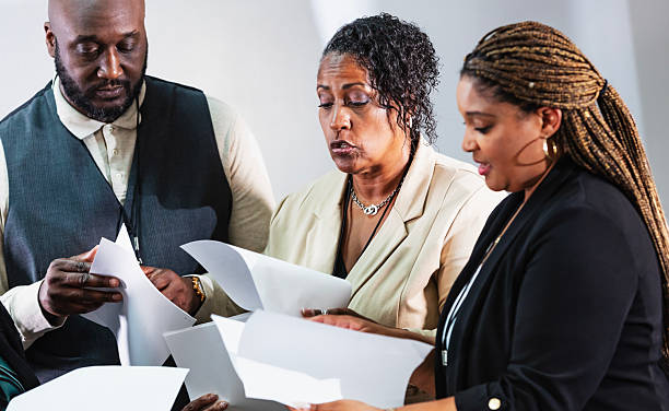 istock Business people in meeting discussing report 2233442618