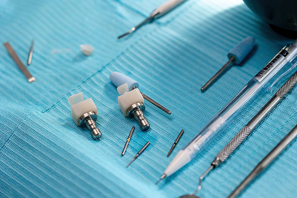 istock Dental CAD/CAM blocks and tools on blue background 2233445730