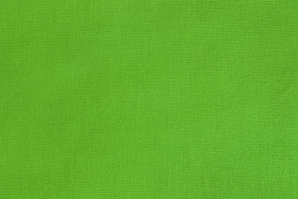 istock Light green cotton fabric cloth texture background, seamless pattern of natural textile. 2233446698