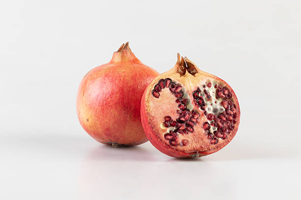 istock Fresh pomegranate fruit isolated nature background with clipping path 2233447166