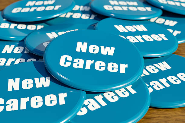 istock New career, blue badges on the table. 2233447519