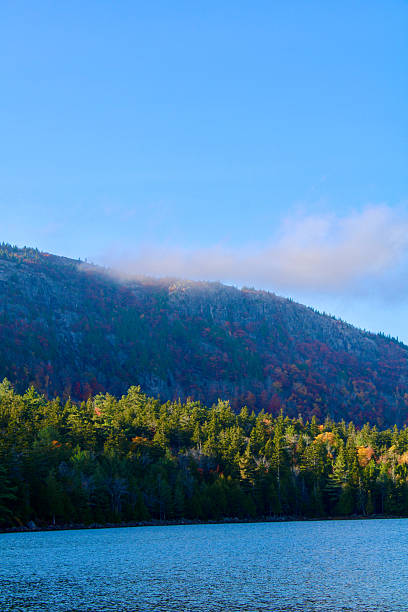 istock Clouds rolling in over the mountains surrounding Jordan Pond 2233448428