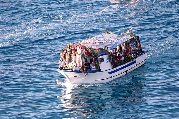 Tropea, Italy – August 15, 2025: Religious boat procession in Tropea during Ferragosto, honoring Mary, Joseph, and Jesus at sea.