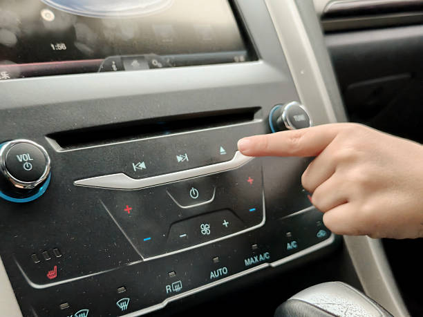 istock Press the buttons in the car again with the child's hand 2233456101