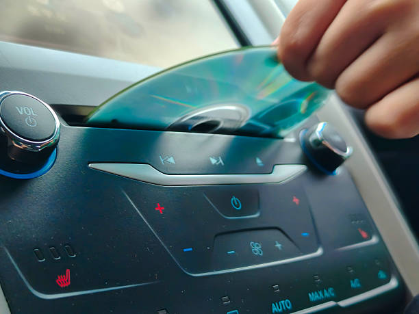 istock Play the CD in the car 2233456110
