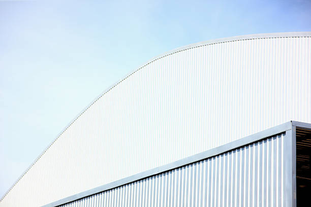 architecture design square shape corrugated wall geometric buiding. The factory warehouse is exterior decorated with corrugated texture to create a point of interest with beautyl