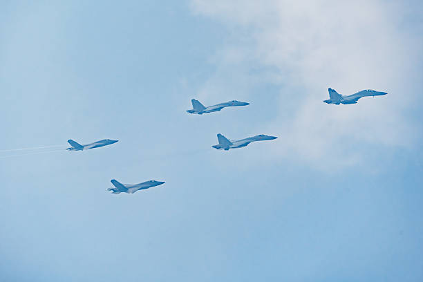 Lockheed Martin F-35 Lightning II and F16 Fighting Falcon of the Dutch Air Force flying in formation during a demonstration flight over The Netherlands to show the new F35 Joint Strike Fighter.
