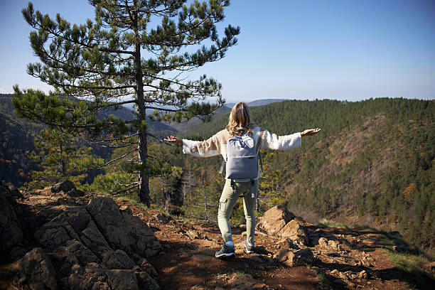 istock Young woman hiking mountain 2233462422