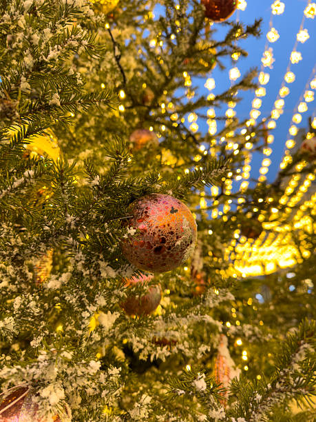 istock A Christmas tree with many ornaments on it 2233462487