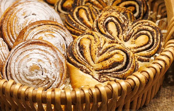 istock A basket of pastries including cinnamon rolls and heart shaped pastries 2233462571