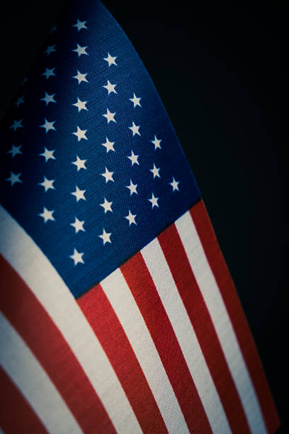 istock American flag on dark background. Close up. 2233465219