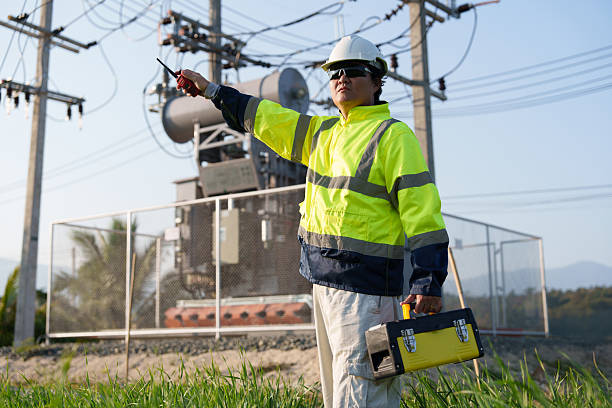 istock An expert engineer is inspecting a high-voltage transformer in a remote rural area.(Photo) 2233466718