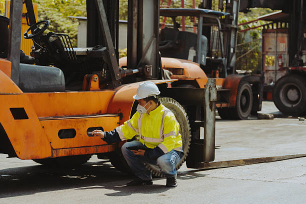 istock Generated The mechanic is checking the forklift before it goes to work 2233466768