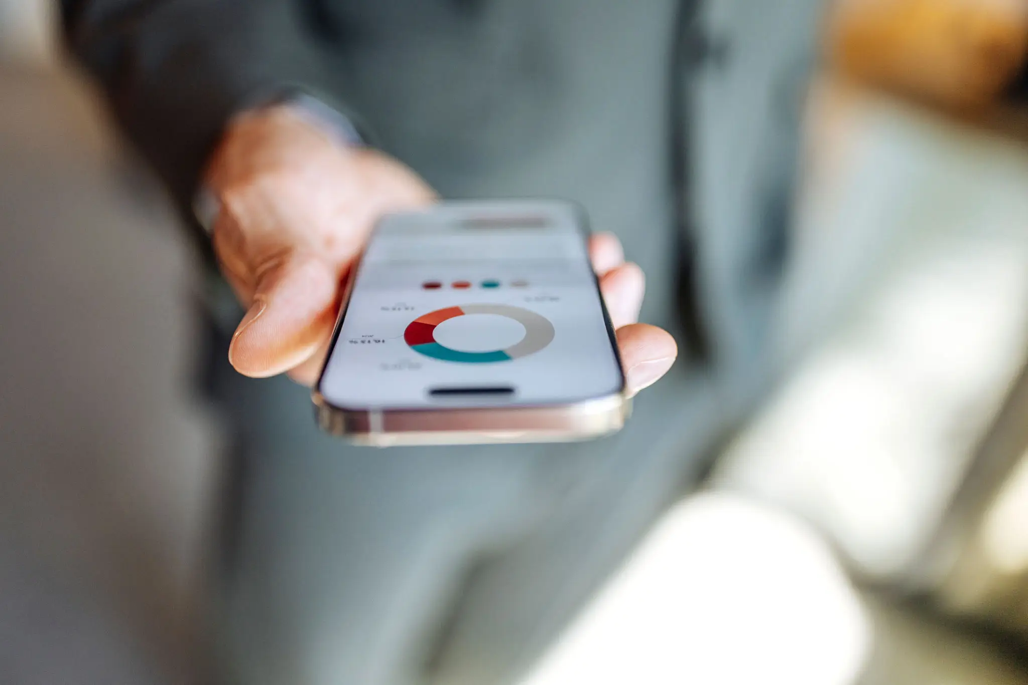 Business Professional Sharing Financial Data on Mobile Device