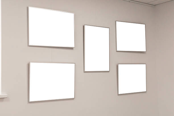 istock Five empty frames hang on a white wall in an art gallery, creating an open space for future exhibitions. The clean design allows for creativity and versatility in showcasing art 2233471371