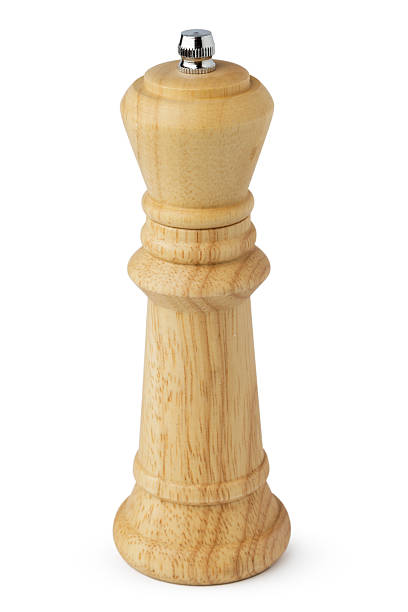 istock Wooden mill for salt or pepper on white 2233471576