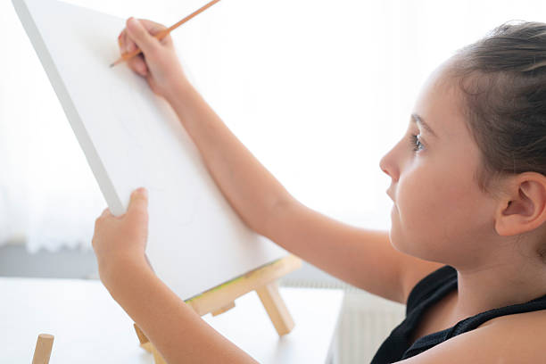 Vertical photo collage of minded girl artist inside wooden frame painter supplies palette paint brush hobby isolated on painted background.