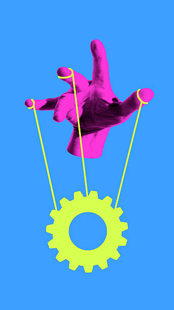 Surreal collage. Hand controlling gear with strings symbol of manipulation strategy and power. Concept of leadership, influence, protest, control, resistance and decision making.