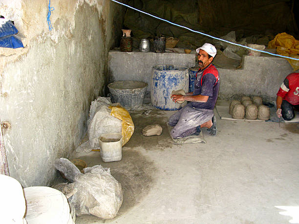 Fez, Morocco - 04 Nov 2010: A worker of hand made fabric of the local market in Fez, Morocco