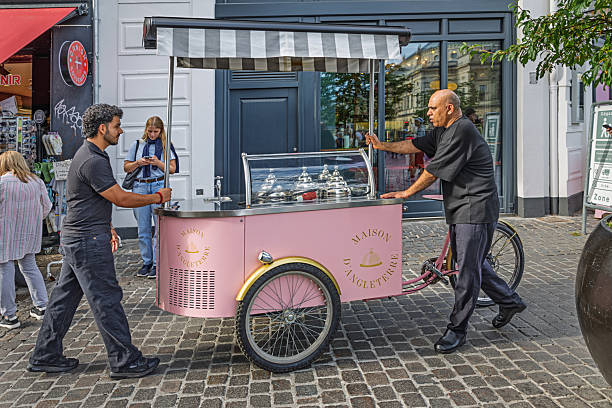 Copenhagen, Denmark - August 30th 2025:  In Copenhagen, bicycles are a versatile part of urban life—used for everything from commuting to creative culinary setups. Here, a mobile street kitchen is transformed into a high-end buffet reminiscent of the city’s finest hotels, showcasing how design and mobility intersect in public space.