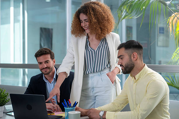 istock Business team collaborating on a project using laptop in office 2233481296