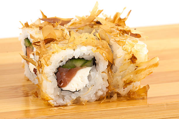 istock Delicious Sushi Roll Topped with Flakes and Fresh Ingredients 2233482341