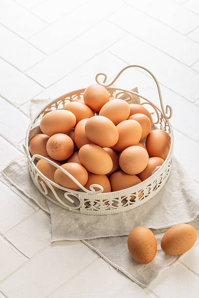 istock Brown organic eggs in a basket on kitchen table 2233482766