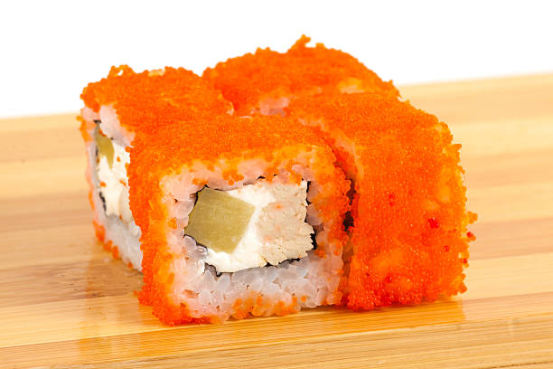 istock Vibrant Sushi Roll with Orange Fish Roe and Creamy Filling 2233482924