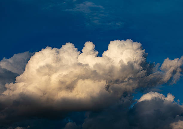 Dramatic White Cumulus Clouds Formation Against Deep Blue Sky - Scenic Weather Background.