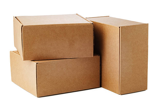 istock Stacked brown cardboard boxes in various sizes arranged on a white background 2233484355