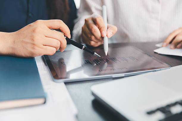 istock Business meeting, data analytics or women with graph presentation in office. Chart, analysis accounting team brainstorming economy, inflation or solution. business project finance investment concept. 2233485135