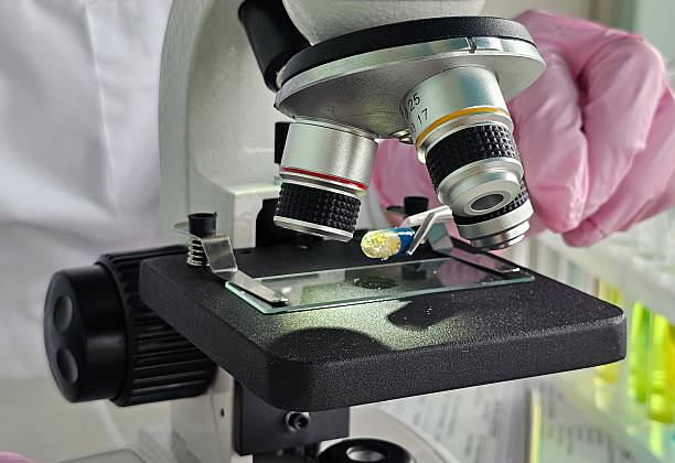 istock Microscope examination of a specimen in a laboratory setting during a scientific research 2233485402