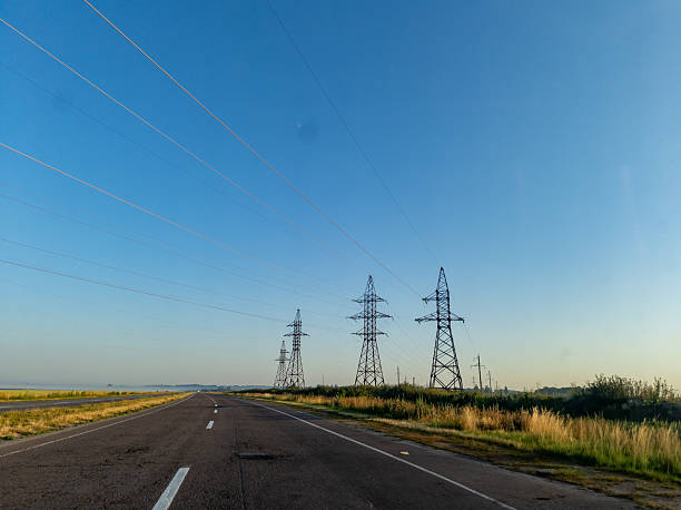 istock A long empty road with power lines in the distance 2233485513