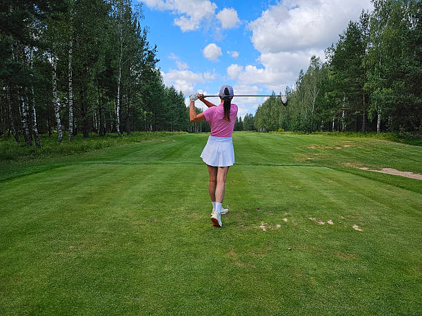 istock Woman practicing golf swing on a sunny day 2233485908